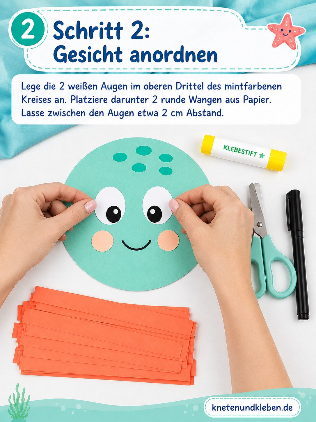 Weiße Augen und runde Wangen werden vor dem Kleben auf dem Papier-Oktopus-Gesicht probegelegt